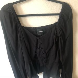 A baby doll button down blouse